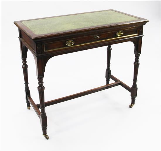 A late 19th century mahogany writing table, by Gillows, W.3ft 2in.